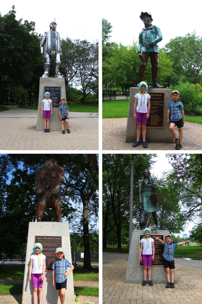 Kids with Wizard of Oz statues
